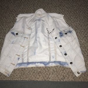 A sleeveless jean jacket